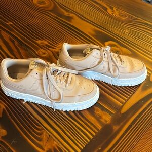 Nike Air Force thick soled shoes.